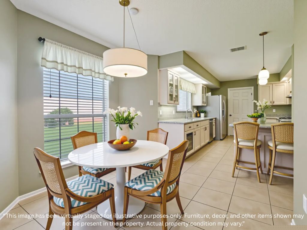 Virtually staged kitchen and dining area at 1701 River Tree Court