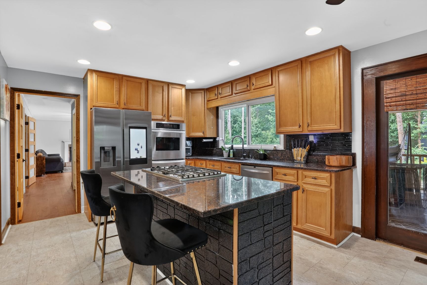 Main kitchen with granite counters and island